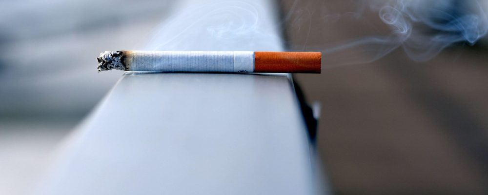 cigarette on handrail cigarette on handrail