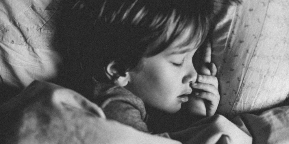 Child sleeping black and white Child sleeping black and white